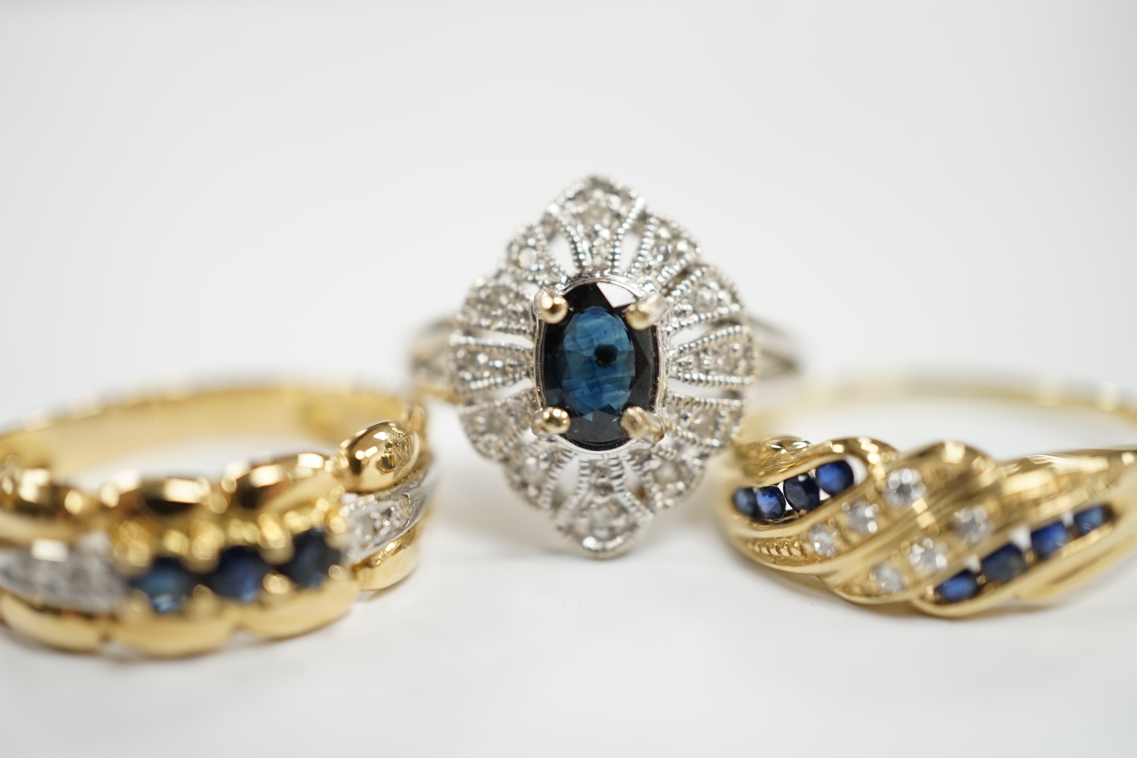 Three assorted 18k, sapphire and diamond chip set rings, including one French ring, gross weight 8.6 grams.